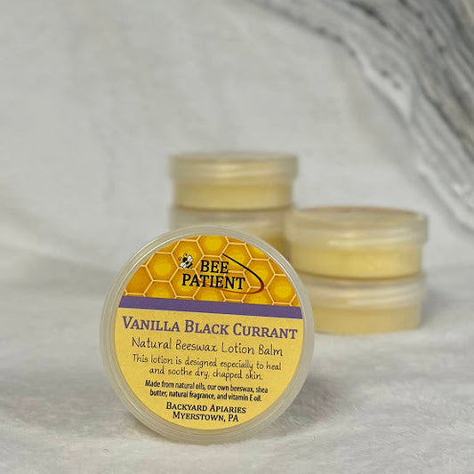 Three small jars of Vanilla Black Currant lotion balm with a visible label on a white background.